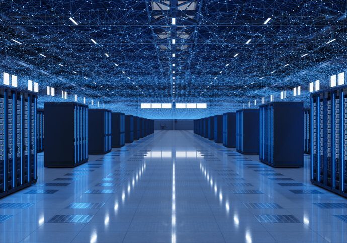 A large, modern data center with rows of server racks and reflective flooring.